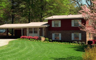 Spacious bi-level home with a split-entry design, large windows, and a well-maintained front yard in a suburban neighborhood