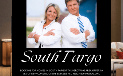 Shannon and Jim, real estate agents, standing confidently with arms crossed in front of a modern building. The image promotes South Fargo homes for sale, highlighting new construction, established neighborhoods, and luxury properties. Website: www.fargohomesearch.com