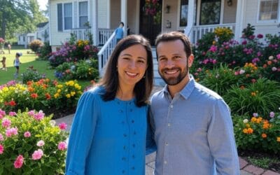 Happy man and woman smiling in front of their new home, excited about their successful real estate experience with Modern Market REALTORS®