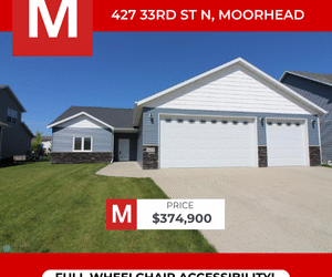 Front exterior of 427 33rd St N, Moorhead MN — one-level patio home with triple garage and full wheelchair accessibility