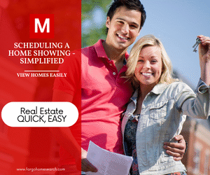Smiling young couple holding house keys and showing paperwork in front of new homes, with red overlay reading ‘Scheduling a Home Showing – Simplified, View Homes Easily’ and Modern Market REALTORS® branding with phone 701-205-5517