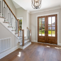 Real estate agent showing a home interior to buyers